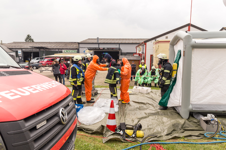 Fireman demonstrate how to handle hazardous material - public demonstration May 2017 in Bleialf, Eifel, Rheinland-Pfalz, Germany, Europe, EUのeditorial素材