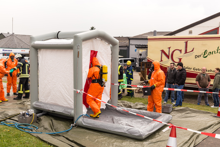 Fireman demonstrate how to handle hazardous material - public demonstration May 2017 in Bleialf, Eifel, Rheinland-Pfalz, Germany, Europe, EUのeditorial素材