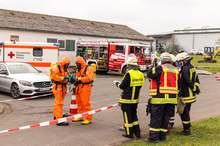 Fireman demonstrate how to handle hazardous material - public demonstration May 2017 in Bleialf, Eifel, Rheinland-Pfalz, Germany, Europe, EUのeditorial素材
