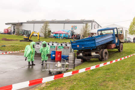Fireman demonstrate how to handle hazardous material - public demonstration May 2017 in Bleialf, Eifel, Rheinland-Pfalz, Germany, Europe, EUのeditorial素材