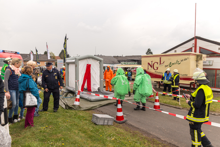 Fireman demonstrate how to handle hazardous material - public demonstration May 2017 in Bleialf, Eifel, Rheinland-Pfalz, Germany, Europe, EUのeditorial素材