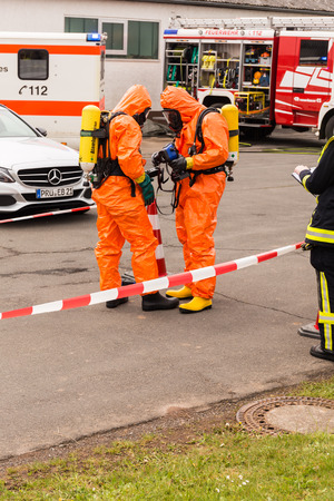 Fireman demonstrate how to handle hazardous material - public demonstration May 2017 in Bleialf, Eifel, Rheinland-Pfalz, Germany, Europe, EUのeditorial素材