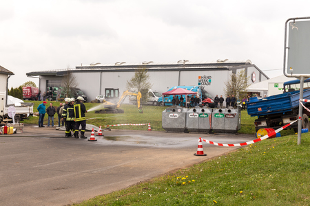 Fireman demonstrate how to handle hazardous material - public demonstration May 2017 in Bleialf, Eifel, Rheinland-Pfalz, Germany, Europe, EUのeditorial素材