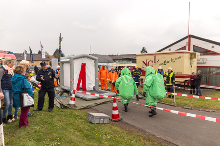 Fireman demonstrate how to handle hazardous material - public demonstration May 2017 in Bleialf, Eifel, Rheinland-Pfalz, Germany, Europe, EUのeditorial素材