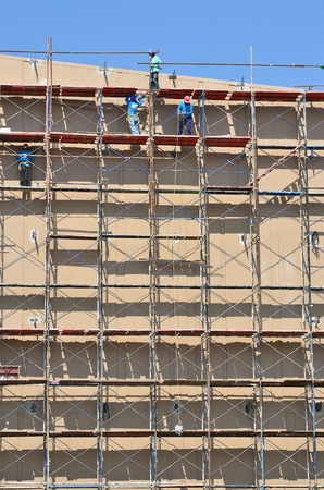 labor working on scaffold in construction siteのeditorial素材