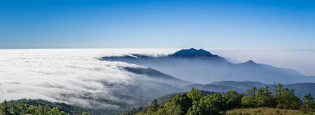 beautiful mist flowing on valley at doi inthanon national park of chiang mai, thailandの写真素材