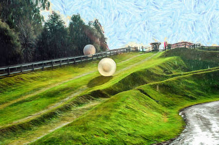 Rolling downhill in a zorb in New Zealandの写真素材