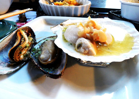 Japan - and oysters on a plate in the restaurant.の写真素材
