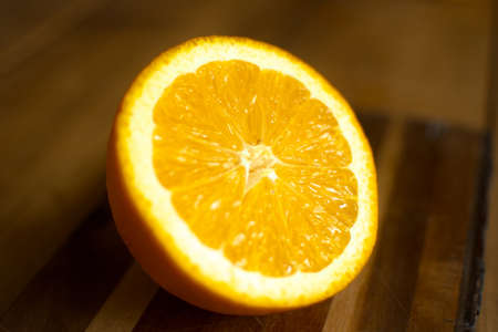Citrus slices on wooden background lined up in a stacked order.
