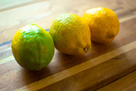 Ripe half of yellow lemon citrus fruit isolated on white background with clipping path