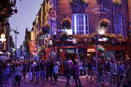 View of the night life in front of the temple bar in Dubin, Ireland.のeditorial素材