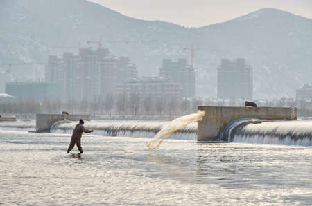 Fisherman in the cityのeditorial素材