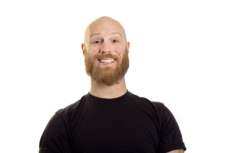 happy young man smiling at the camera isolated on white backgroundの写真素材