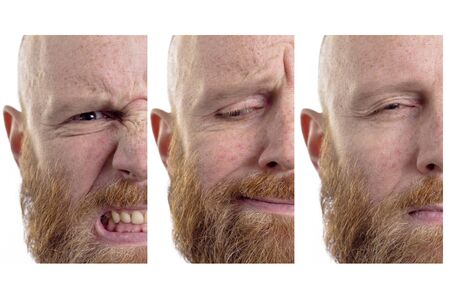 bald man red beard different emotions angry seriousの写真素材