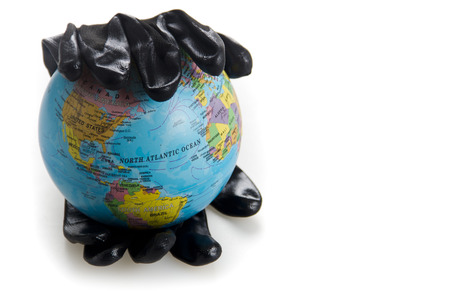 save our planet, world in black oil hand isolated on white background