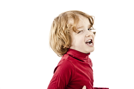 eye blink red hair toddler isolated on white backgroundの写真素材