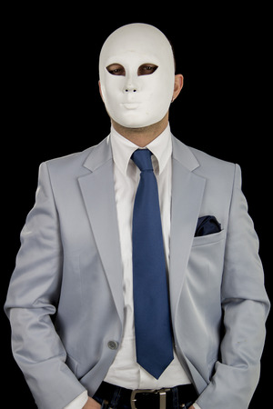 businessman in suit wearing mask, business powerの写真素材