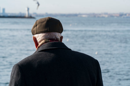Lonely old man looking to sea.の写真素材