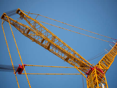 sling line and derrick of crane with clear skyの写真素材