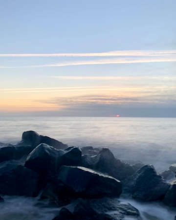 Sunrise through the cloudsの写真素材