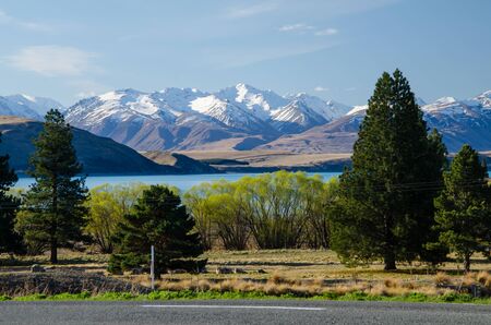 Lake Tekapo with snow covered mountains in the background, Canterbury, South Island, New Zealandの写真素材