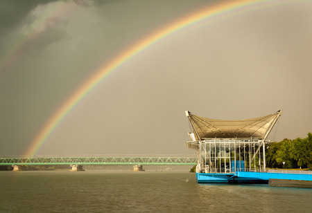 Rainbow over the danube in Tulln (Austria)の写真素材