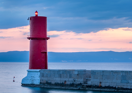 Sunset at the red lighthouse in Cres (Croatia)の写真素材