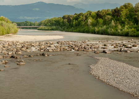 River Bregenzer Ache with mountains in the background in summer, Austriaの写真素材