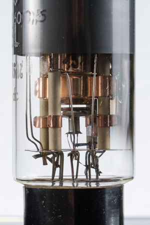 Closeup of an old electronic vacuum tube, white background