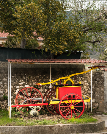 Old vintage manual red yellow pump of fire brigade in Croatia