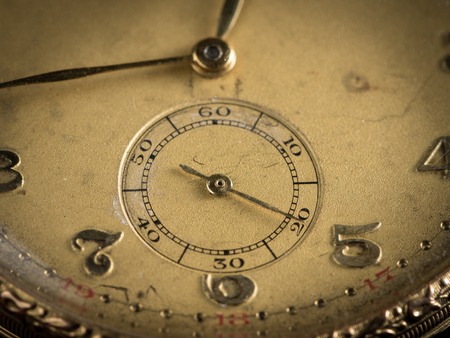 Detail of an old woman's golden pocket watchの写真素材