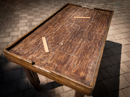 Old wooden table for playing table football, markings of matchfield and rulersの写真素材