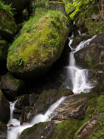 Waterfall, cascade between big rocks in ravine Ysperklamm (Waldviertel, Austria)の写真素材