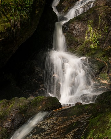 Waterfall, cascade between big rocks in ravine Ysperklamm (Waldviertel, Austria)の写真素材