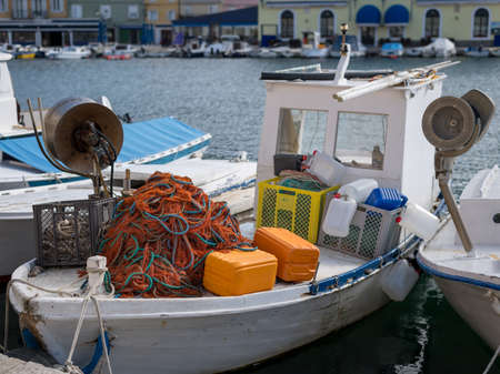 Closeup of a colorful fishing net and other accessories lying on a boat, Cres Croatiaの写真素材