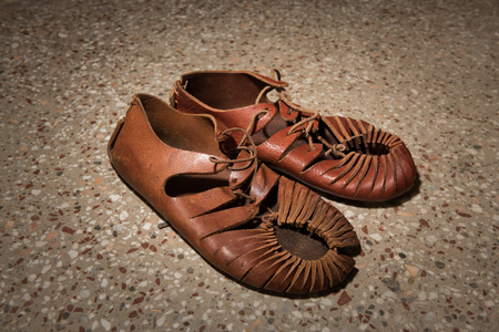 Closeup of a pair of roman sandals made of leatherの写真素材