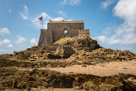 Fort on the island Petit-Be, Saint-Malo (Brittany, France) at low tide on a sunny day in summerの写真素材