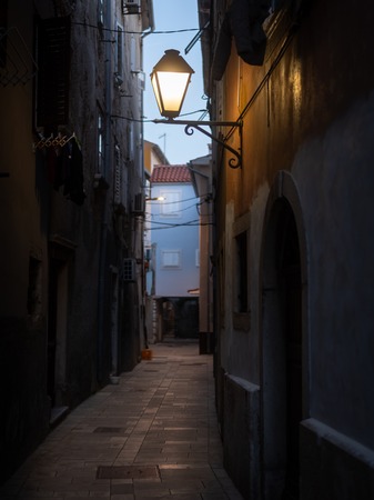 Street lamp in the city of Cres (Croatia) in the eveningの写真素材