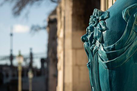 Face of a lion on a big vase in a park (Vienna, Austria)