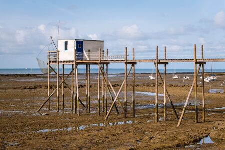 boardwalk made of wood during low tide on a beach near la rochelleの写真素材