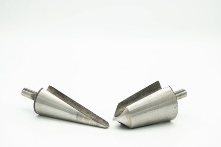Closeup of two countersink cutters lying on a white backgroundの写真素材