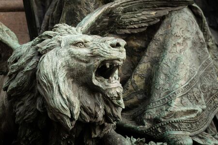 Closeup of a statue of a lion made of bronze in Veniceの写真素材