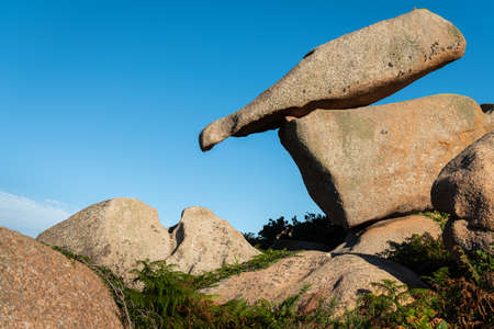 Interesting rock formation (bottle) on Pink Granite Coast in northern Brittany (France), on a sunny day in summerの写真素材