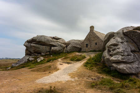 House between rocks in Meneham on the atlantic coast in northern Brittany (France), cloudy day in summerのeditorial素材