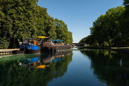 Chalon en Champagne, France - August 07, 2020: Canal with boats on a hot sunny day in summerのeditorial素材