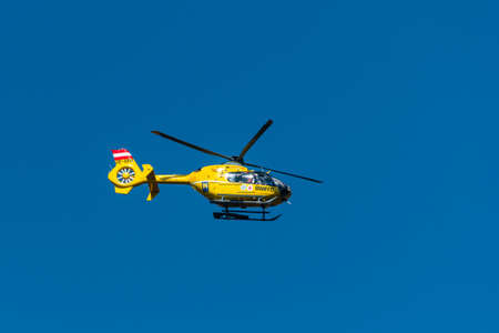 Vienna, Austria 31 March 2021: An Austrian ambulance helicopter flying, blue skyのeditorial素材