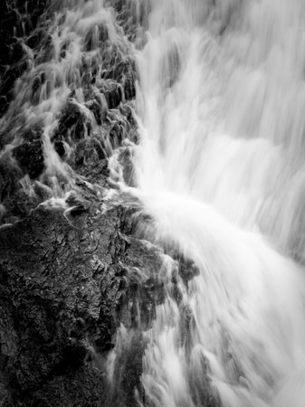 Closeup of a waterfall in the alps in summer, East Tyrol (Austria), black and whiteの写真素材