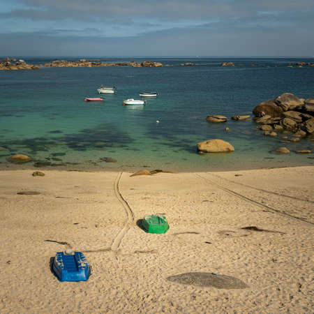 Lanilis, France - August 10, 2020: Small boats in the water on a sunny day in summer, beachのeditorial素材