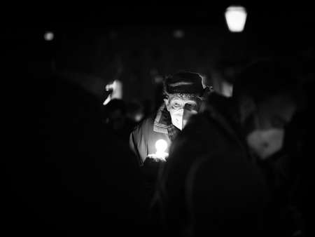 Vienna, Austria - February 27, 2022: People demonstrating against war in Ukraine on Heldenplatz, night, burning candles on the groundのeditorial素材