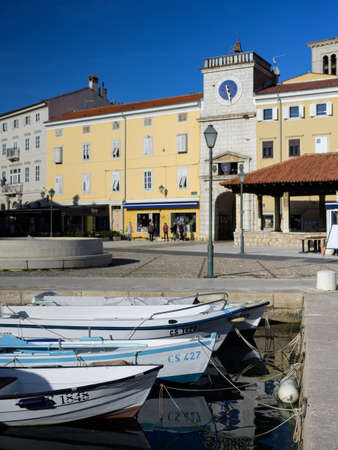Old city gate and market place in Cres (Croatia) on a sunny day in springのeditorial素材